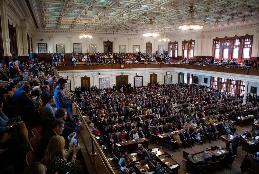 State Representatives and their families sit on the House floor on the opening day of the 88th Legislative Session at the state Capitol in Austin on Jan. 10, 2023.