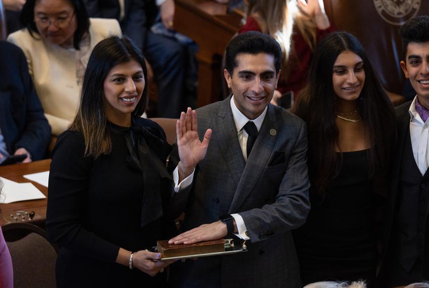 State Rep. Salman Bhojani, D-HD92, swears in on a copy of the Quran the on the opening day of the 88th Legislative Session at the state Capitol in Austin on Jan. 10, 2023.