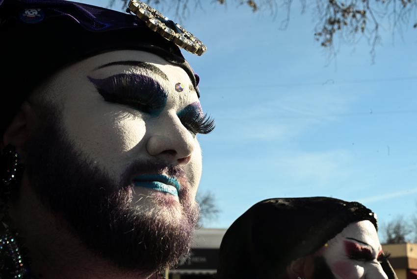 Daphne joins drag show supporters in makeup and robes outside BuzzBrews on Jan. 14, 2023.