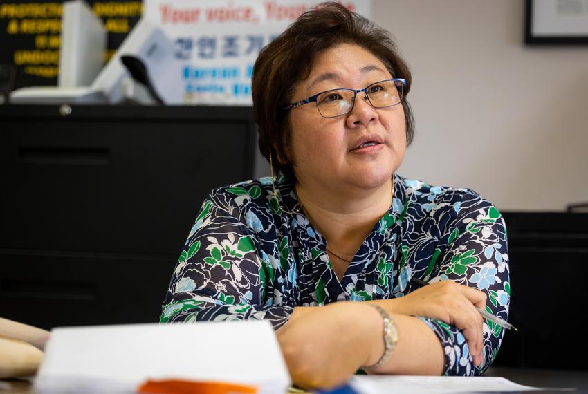 Terry S. Yun listens and provides translating services for a couple at the Korean Community Center in the Spring Branch district of Houston, TX, on Thursday, Feb. 23, 2023.
