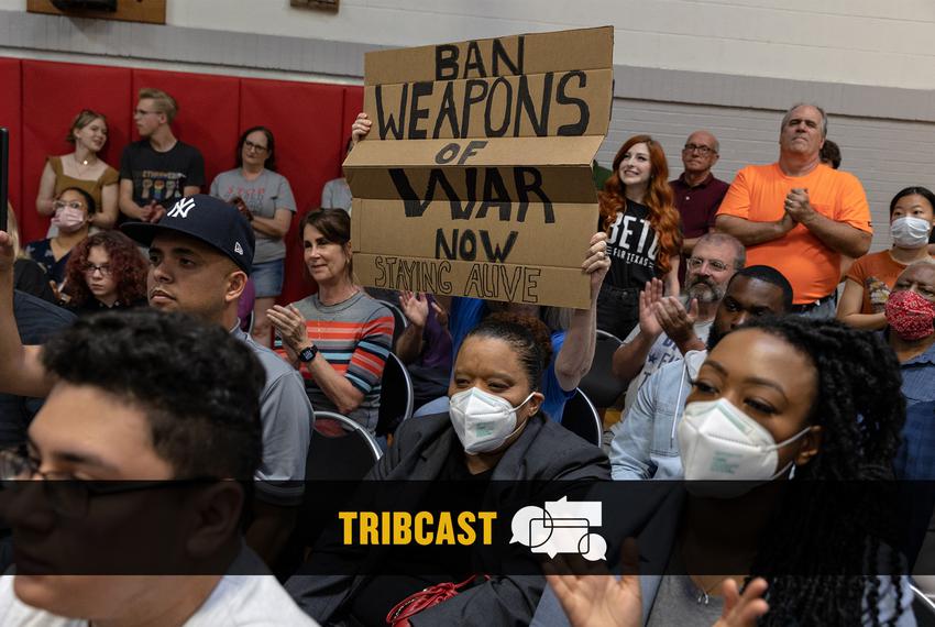 Attendees of a town hall over the shooting at Robb Elementary in Uvalde and gun reform holds up signs demanding the banning of assault rifles in Dallas on June 1, 2022.
