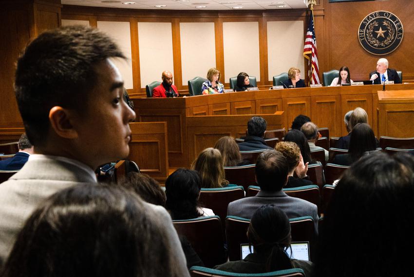 Stephen Wu waits in the back of the room while the Human Services committee comes to order in the early morning at the state Capitol in Austin on April 25. 2023.