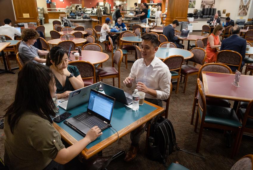 Nicole Ma, Steven Wu, and Quỳnh-Hương Nguyễn of Woori Juntos set up their laptops to catch up on emails and online meetings at the Capitol Grill while they wait for the Senate to convene after trying to meet with the office of Dade Phelan, the House Speaker, and various senators in the state Capitol in Austin on May 22, 2023. The Woori Juntos organizers have shifted focus for the remaining time in the Legislative session, to begin cultivating potential alliances for next session and by trying to get an Interim Charge for their main issue, relating to increasing language accessibility for Texans in state health programs. An Interim Charge, in the Texas House, is a directive to study a certain issue during the interim that is issued by the lieutenant governor to a Senate committee or by the speaker of the House to a House committee.