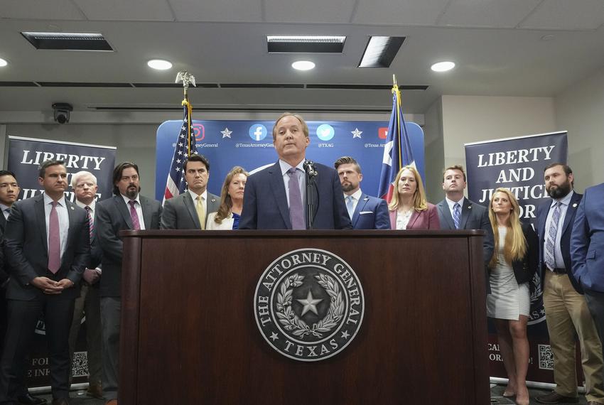 At a press conference on May 26, 2023, Attorney General Ken Paxton with aides, from left to right: Tommy Tran, executive assistant; James R. Lloyd, associate deputy attorney general for civil litigation; Austin A. Kinghorn, associate deputy attorney general for legal counsel; Ryan Fisher, director of government relations; Joshua Reno, deputy attorney general for criminal justice; Suzanna Hupp, special adviser; Brent Webster, first assistant attorney general; Lesley French, chief of staff; George Lane, adviser; Paige Willey, deputy communications director; and Ralph M. Molina, deputy attorney general for legal strategy.