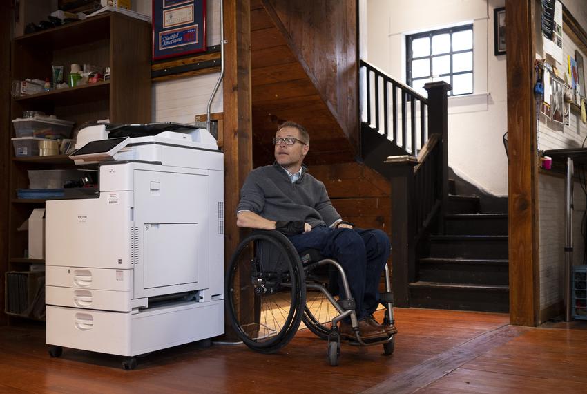 Chase Bearden, 45, of Harlingen, the deputy executive director of The Coalition of Texans with Disabilities, poses for a portrait in his office in Austin on June 8, 2023. “Disability doesn’t discriminate,” Bearden said. “We want everybody to be able to vote independently.”