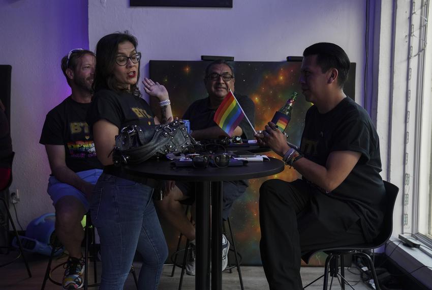 Linda Tolman, LGBTQ Task Force secretary, center left, passes her time with Cesar A. Villarreal, right, the vice chair, and others before the Pride Pub Crawl at The Rocket Bar in Brownsville, Texas on June 17, 2023.
Verónica G. Cárdenas for The Texas Tribune