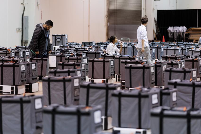 Ballot boxes and machines are organized in place after processing in Houston, Tuesday Nov 8, 2022 at central counting. (Michael Stravato for the Texas Tribune)
