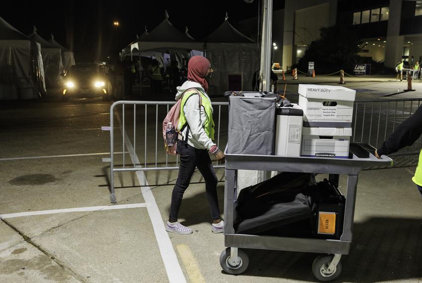 Ballots and scanning machines arrive at central counting after polls close in Houston on Tuesday Nov. 8, 2022.