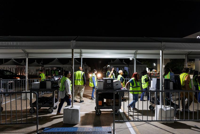 Ballots and scanning machines arrive at central counting after polls close in Houston, on Nov 8, 2022.