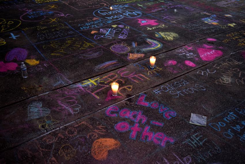 Messages written in sidewalk chalk are seen as people gather for a vigil following Saturday's shooting in Odessa, Texas, U.S. September 1, 2019. REUTERS/Callaghan O'Hare - RC184FA52BB0