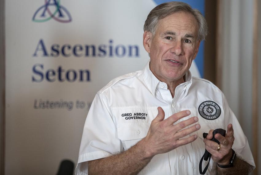 Gov. Greg Abbott speaks to local media before receiving a dose of the Pfizer-BioNtech COVID-19 vaccine at Ascension Seton Medical Center on Dec. 22, 2020, in Austin.