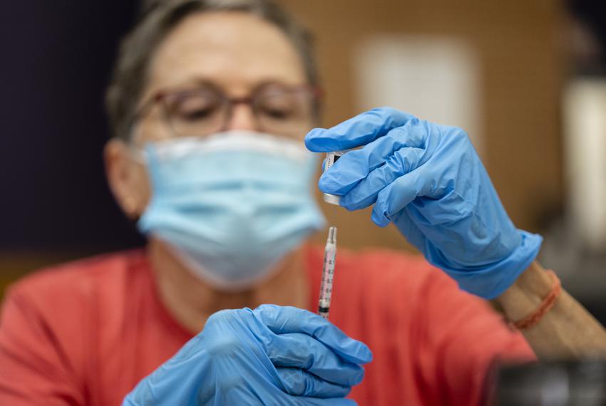Diana Phipps pulls up doses of the Pfizer vaccine into syringes at a clinic organized by the Travis County Mobile Vaccine Collaborative at Rodriguez Elementary School on July 28, 2021.

Source diversity info: White Female