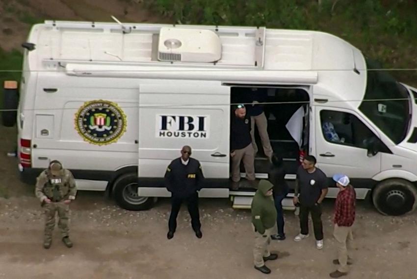 In a still image from video, an aerial view shows an FBI van at a location where a search is being conducted for Francisco Oropesa, 38, who police say shot dead five neighbors in Cleveland, Texas, on April 29, 2023, the day after the shooting.
