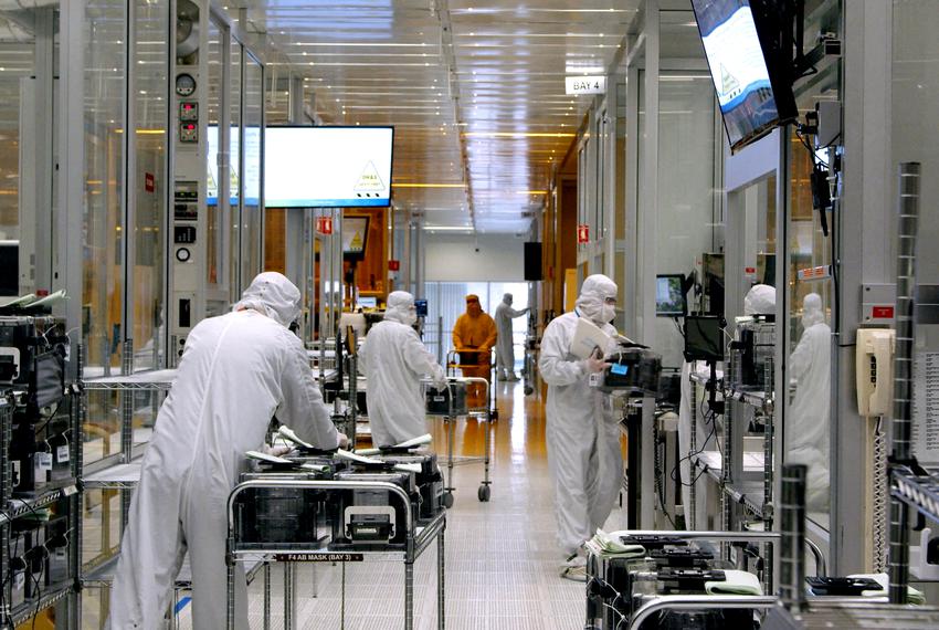 Workers inside the clean room of U.S. semiconductor manufacturer SkyWater Technology, where computer chips are made, in Bloomington, Minnesota in April, 2022.