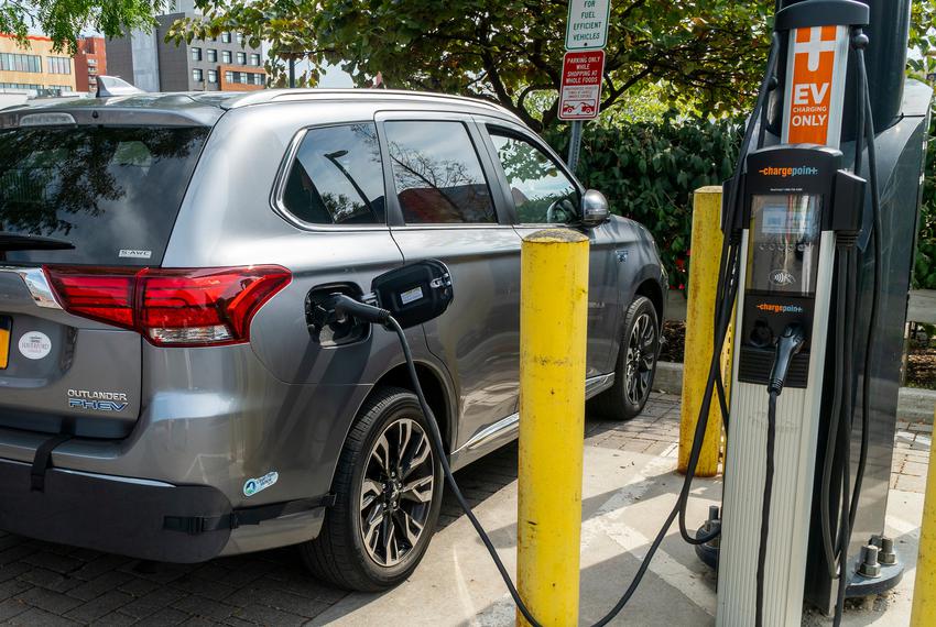 A Mitsubishi Outlander PHEV  plug in hybrid vehicle is charged at a public charging station in Brooklyn, New York on Saturday, Sept. 3, 2022.