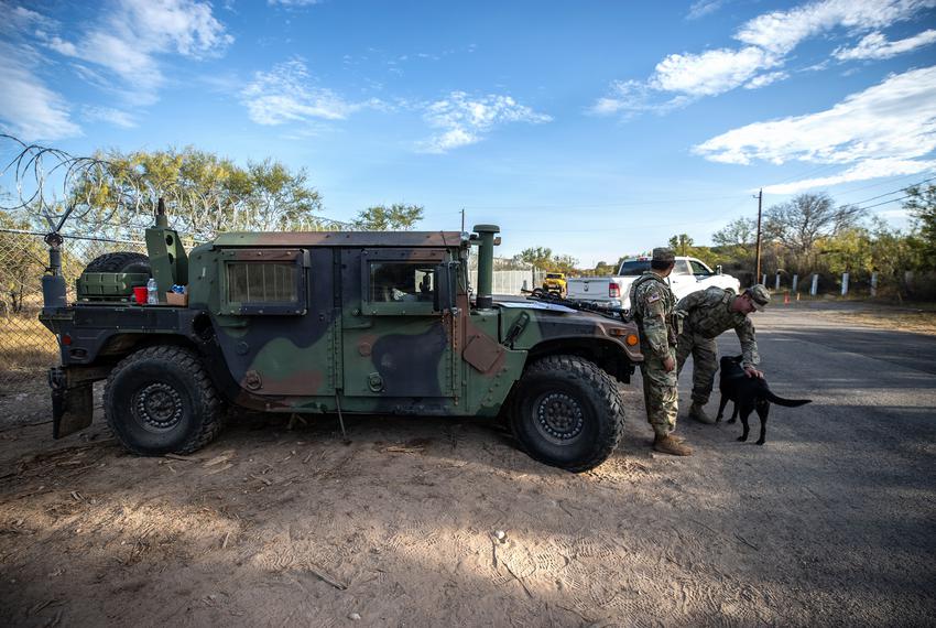 Members of the Texas National Guard work 12 to 13 hour shifts guarding the “Texas border wall,” construction crews and materials near Del Rio on Dec. 8, 2021. Thousands of National Guard troops were deployed to Del Rio after an increase in migration at the southern border.