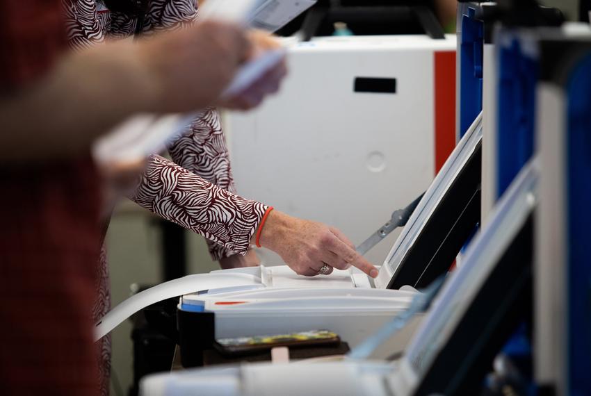 A bipartisan testing crew uses voting machines and tabulators during a state-mandated logic and accuracy test at the Hays County Government building in San Marcos on Sept. 21, 2022. The goal of the test was to identify errors in the counting process of ballots.