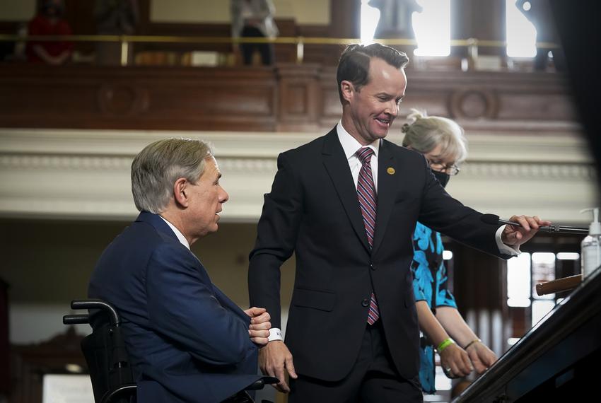 Newly-elected House Speaker Dade Phelan greets Gov. Greg Abbott before speaking to the Texas House during opening ceremonies as the 2021 Texas Legislature gets down to work in Austin on Jan. 12, 2021.