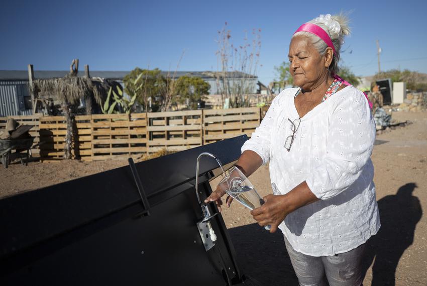 Olga Thomas and other residents of Hueco Tanks rely on a private company to haul water to their neighborhood. Now she can count on her hydro panels for drinking water. May 23, 2023.
