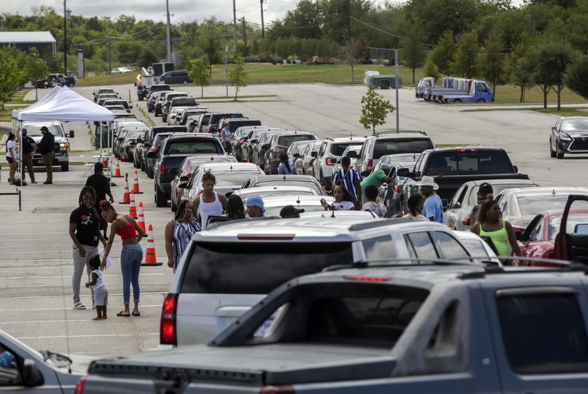 Hundreds of Hurricane Laura evacuees wait in their cars as they line up for hotel vouchers at the Circuit of the Americas in Austin on Aug. 26, 2020. Texans from the pocket of the state expected to be hit hardest by Hurricane Laura waited hours at Circuit of Americas for shelter. The city of Austin said they would provide hotel vouchers for evacuees, however many hotels in the city have filled up forcing hundreds of people to drive from Austin to San Antonio or Ennis.