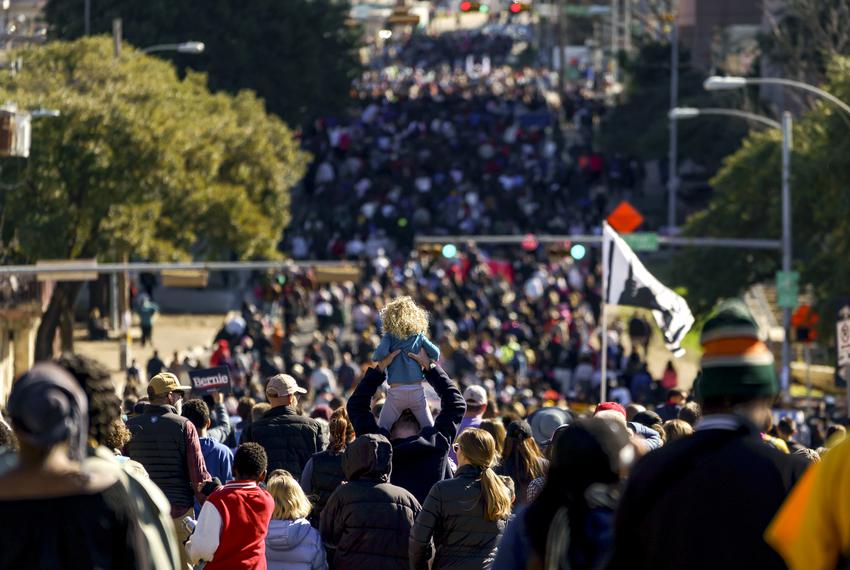 Crowds march through Austin in celebration of Martin Luther King Day on Jan. 20, 2020. 
