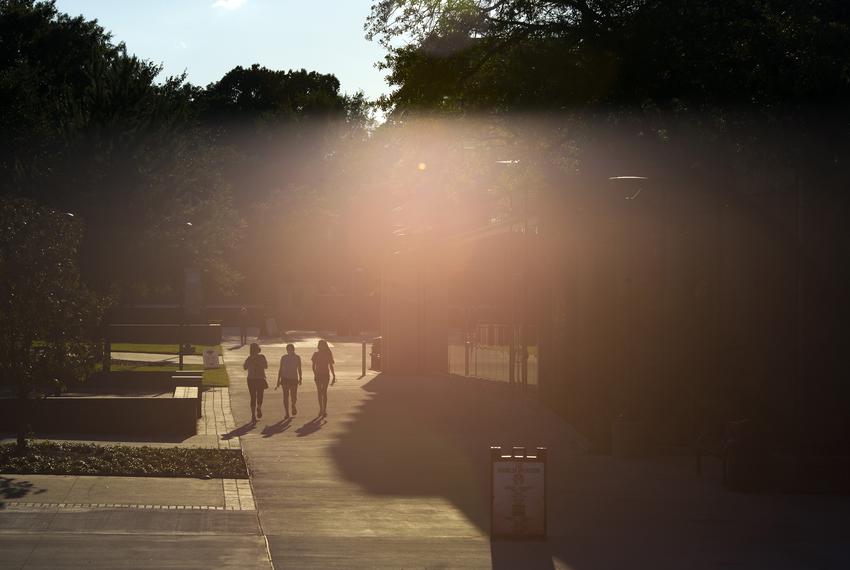 Students walk across the campus at Sam Houston State University on Aug. 20, 2020, in Huntsville.
