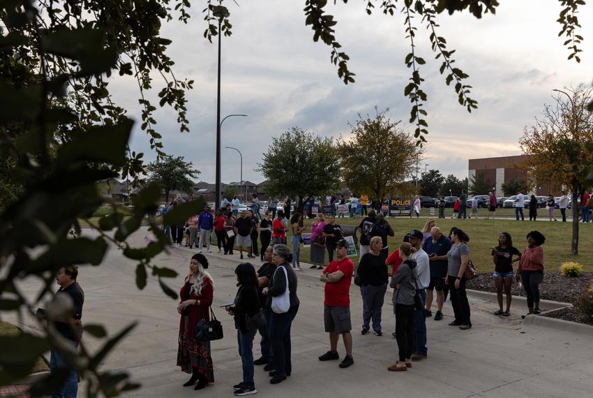 Voters wait in line to cast their ballots on Election Day at the Northwest Branch Library in Fort Worth on November 8, 2022.