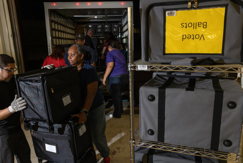 Election workers move ballots and equipment gathered at one of the nine rally sites to the Tarrant County Election Administration building in Fort Worth on November 8, 2022.
