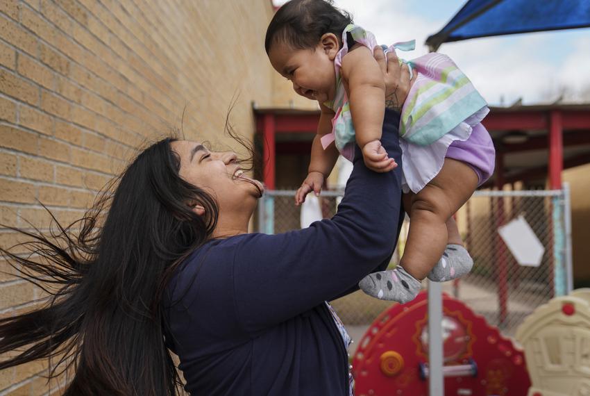 Junior Iryanna Rodríguez, 18, is with her nine-month-old daughter Ariyanna Juliett Fuentes at Lincoln Park School in Brownsville on Feb. 16, 2022. The school for students that are pregnant or have had a baby currently has 69 students enrolled.