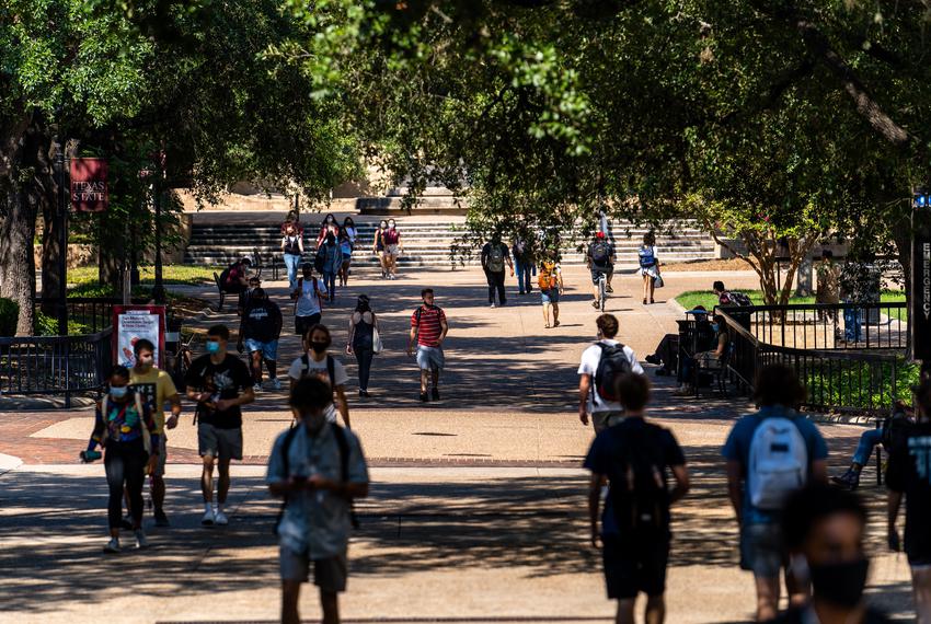 Students walk through an area known as “The Quad” on the first day of the fall semester at Texas State University in San Marcos on Aug. 24, 2020.