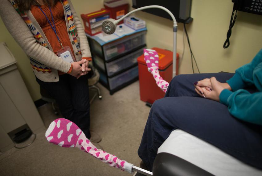 A nurse practitioner consults with a patient at a Planned Parenthood clinic in Austin.
